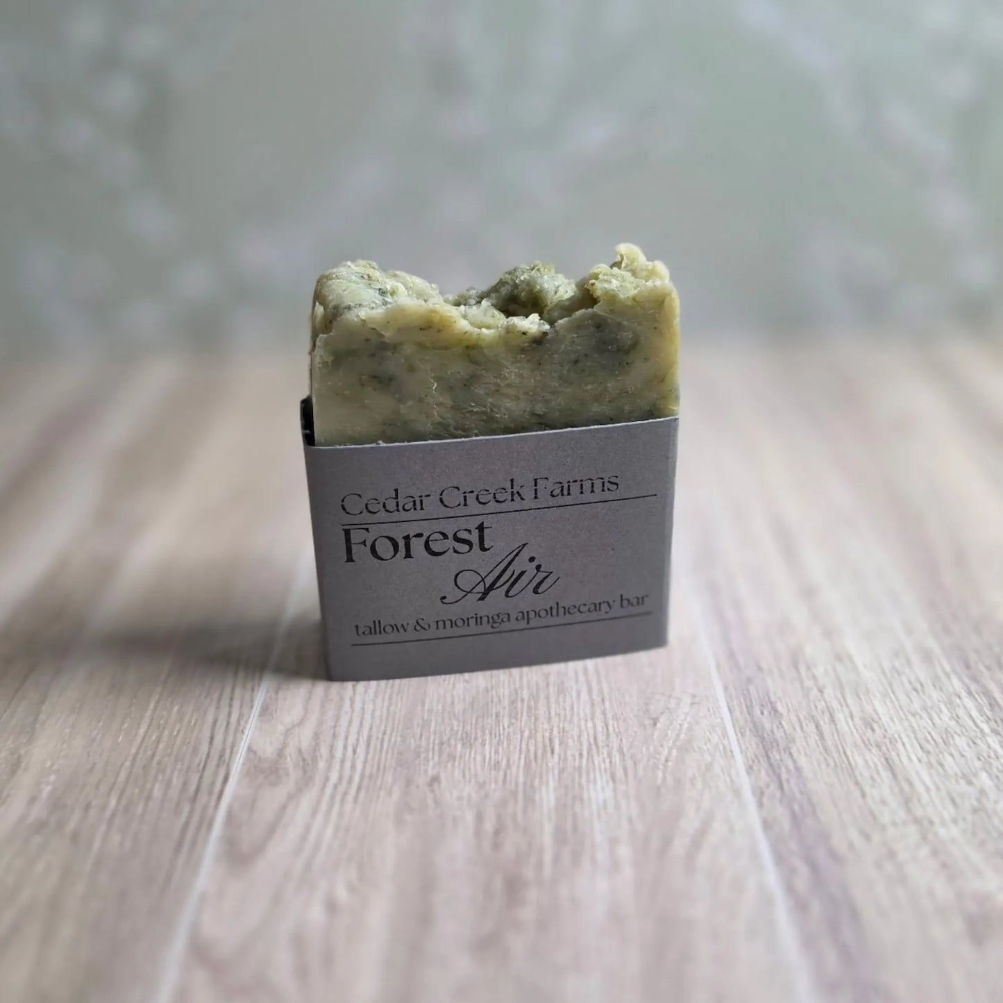 Cedar Creek Farms Forest Air green soap bar tallow and moringa apothecary bar, natural handcrafted botanical soap on wood surface