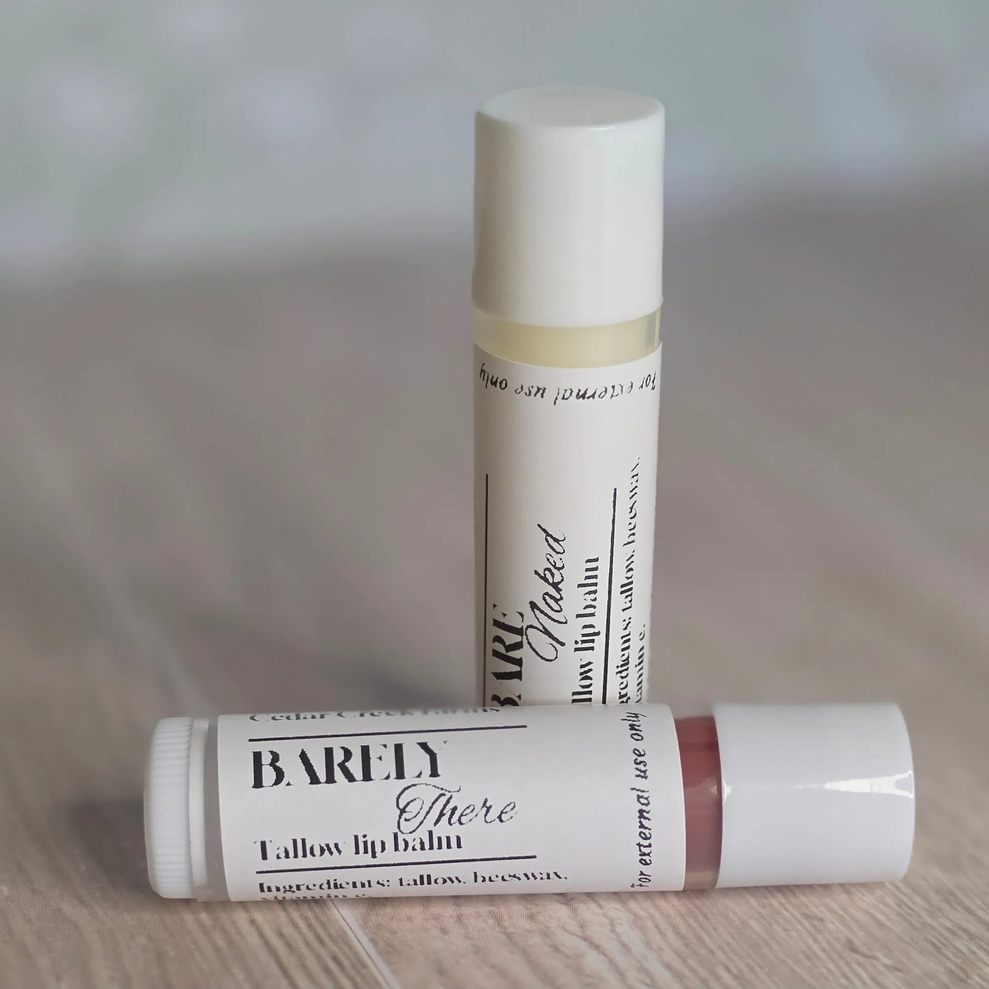 Cedar Creek Farms Bare Naked and Barely There tallow lip balm duo natural and tinted lip balm tubes displayed together