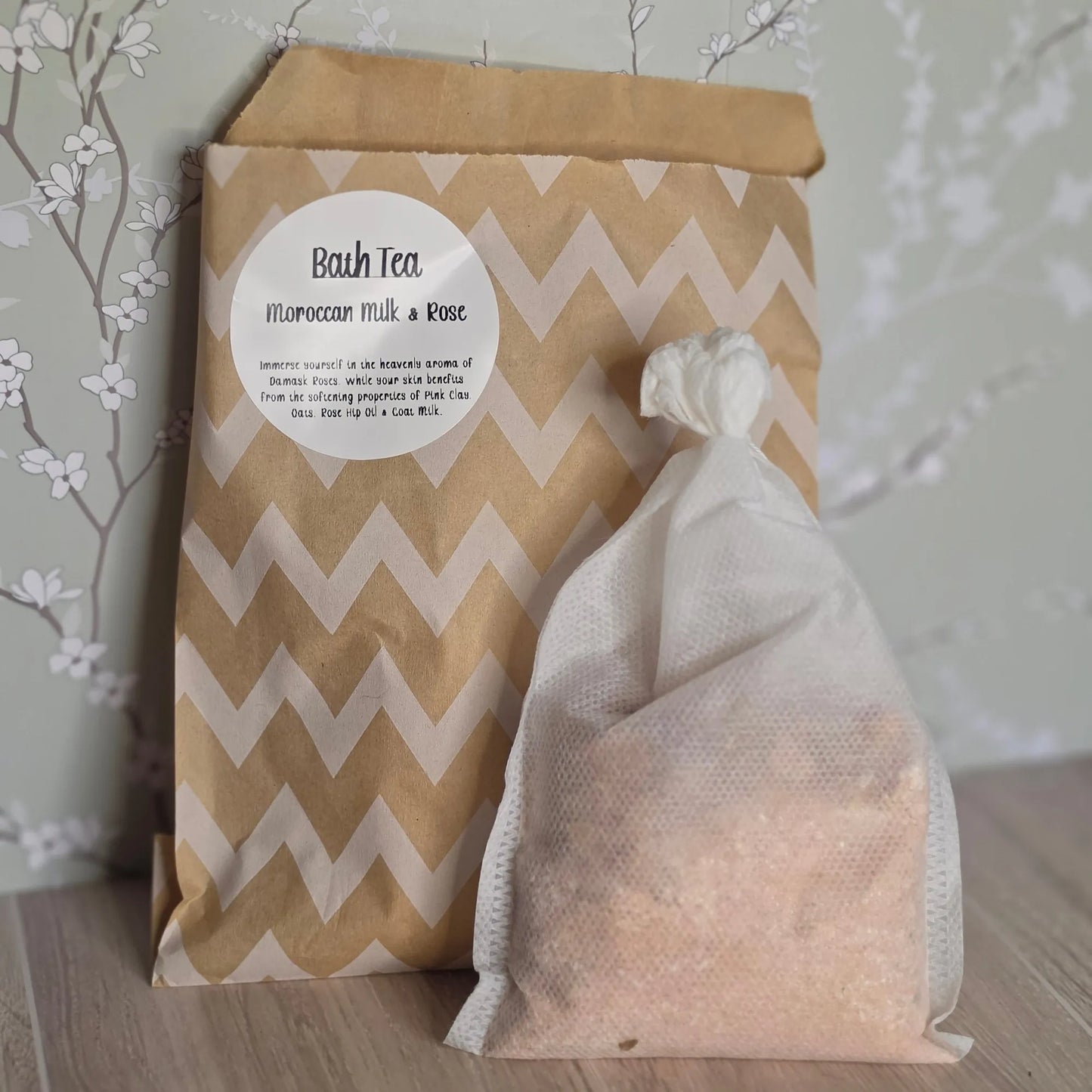 Cedar Creek Farms Bath Tea Moroccan Milk & Rose front packaging product view showing bath tea sachet with pink botanical blend in front of labeled kraft pouch on wooden surface