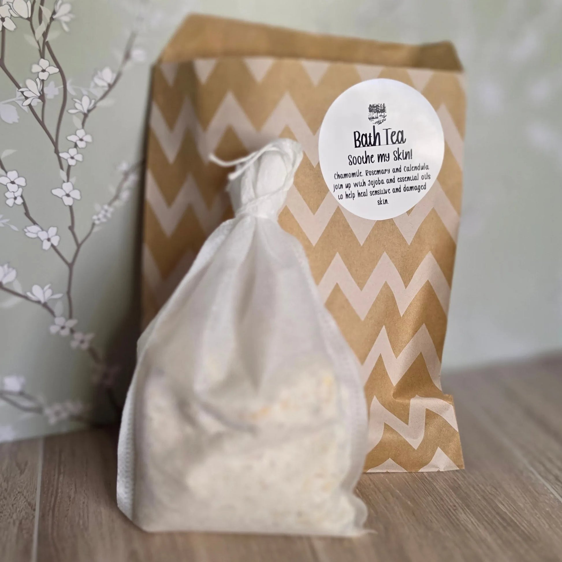 Cedar Creek Farms Bath Tea Soothe My Skin close-up front packaging product view showing herbal bath tea bag in foreground with labeled kraft pouch behind on wooden surface