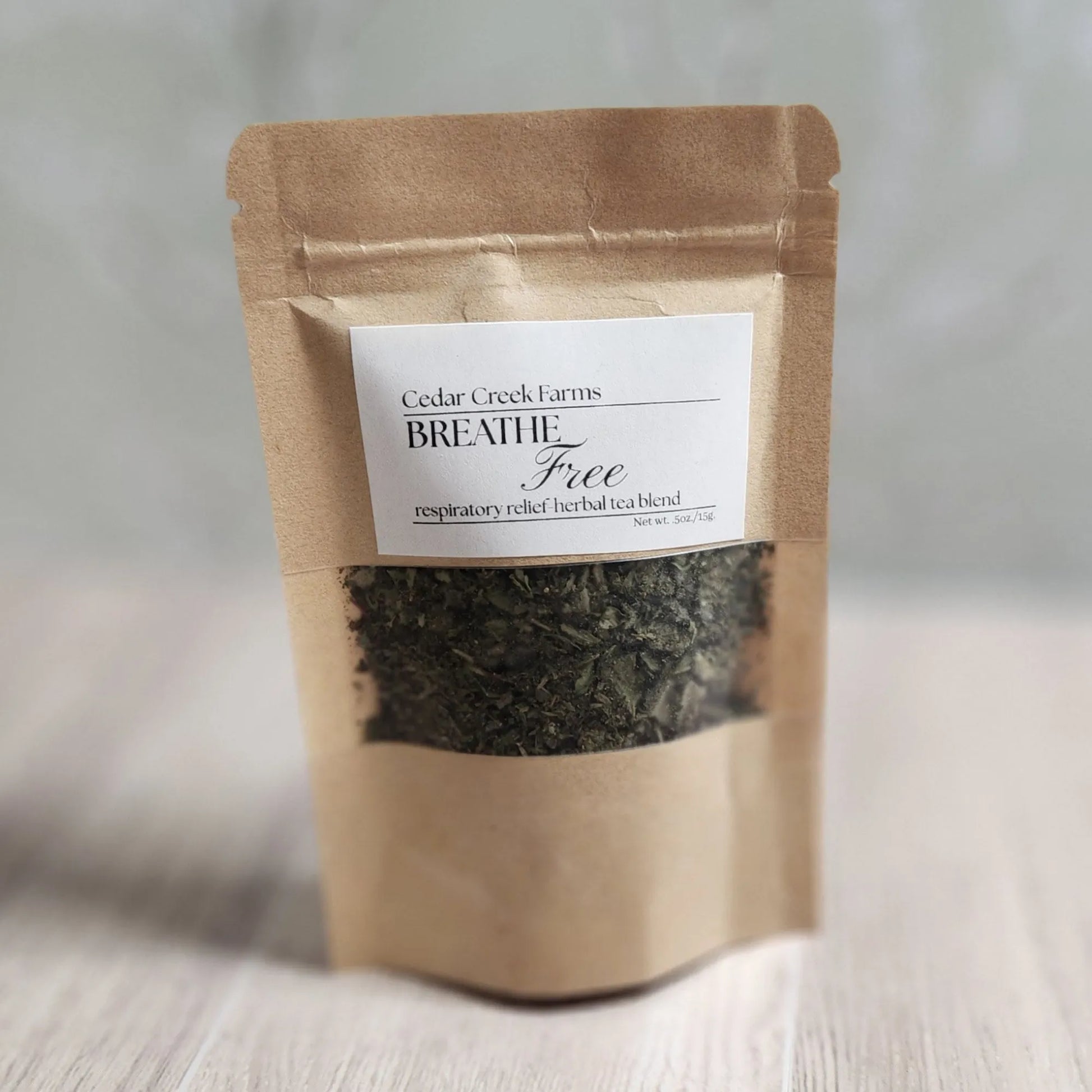 Cedar Creek Farms Breathe Free herbal tea blend for respiratory relief in kraft pouch with visible loose leaf herbal ingredients