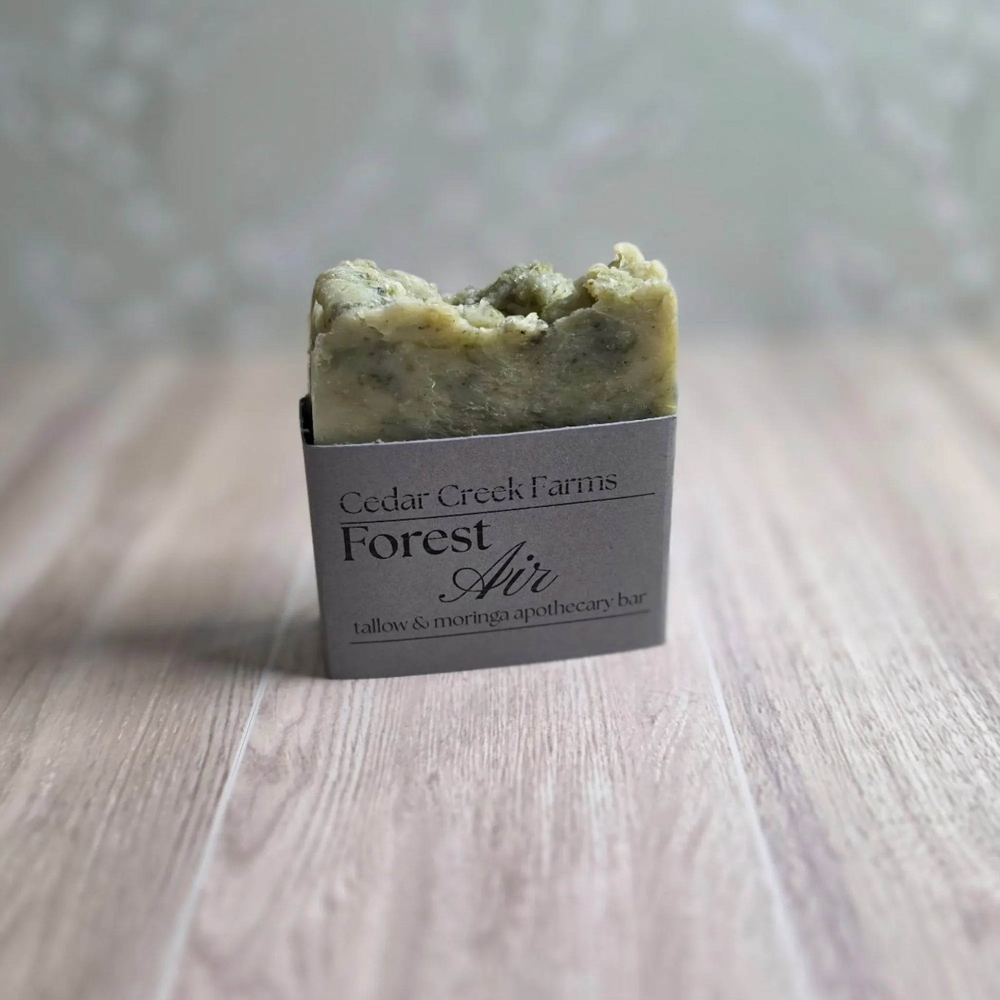 Cedar Creek Farms Forest Air green soap bar tallow and moringa apothecary bar, natural handcrafted botanical soap on wood surface