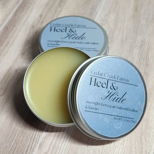 Cedar Creek Farms Heel and Hide foot repair balm with tallow and lanolin open tin showing balm texture with multiple tins