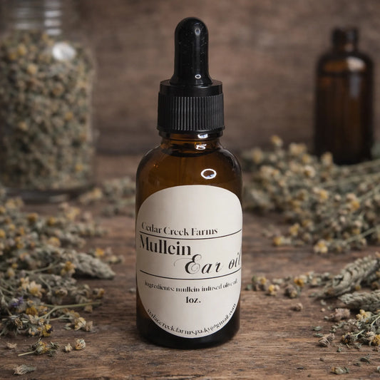 Cedar Creek Farms mullein ear oil natural herbal remedy dropper bottle with dried herbs on wooden surface