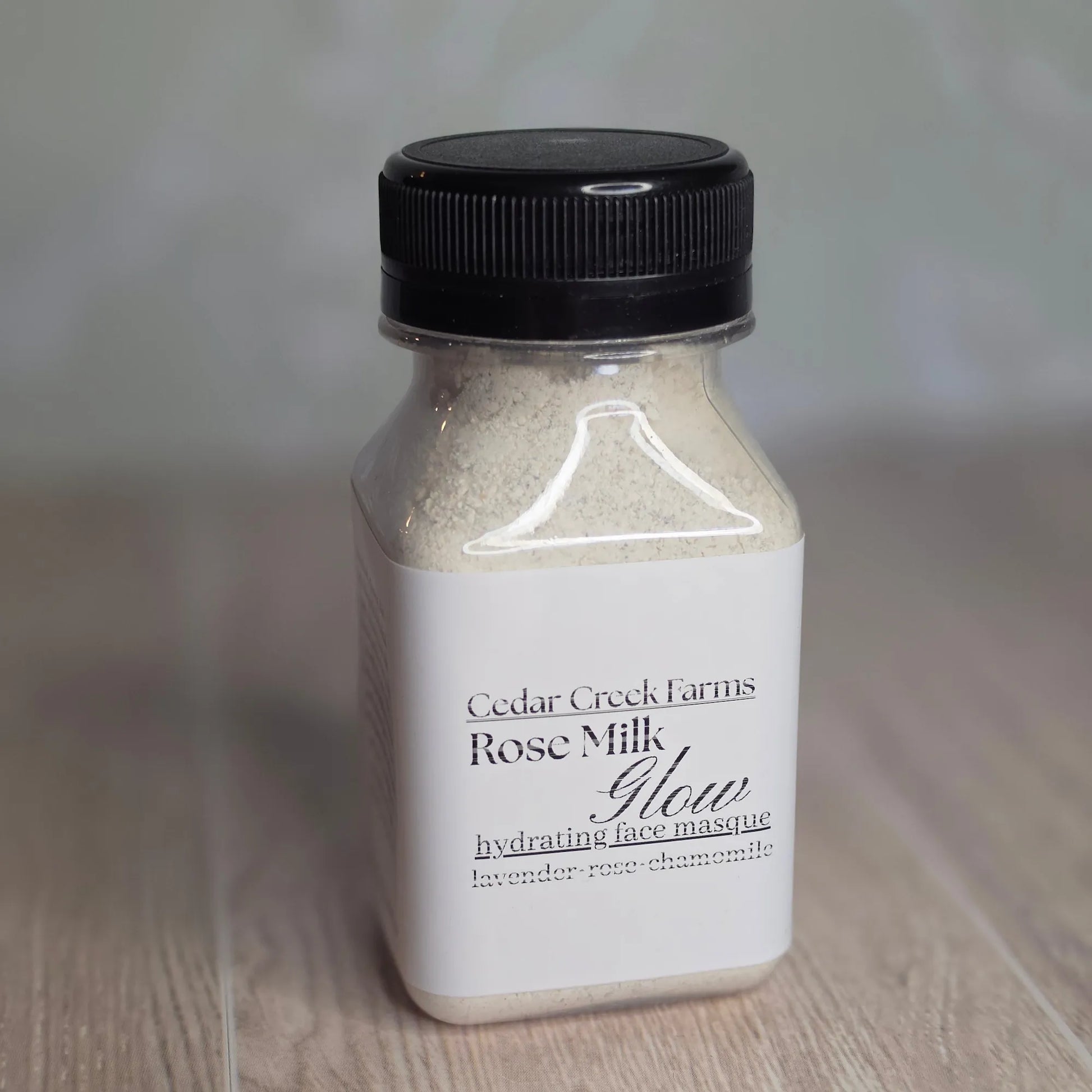 Cedar Creek Farms Rose Milk Glow hydrating face mask powder in bottle with lavender rose chamomile front view