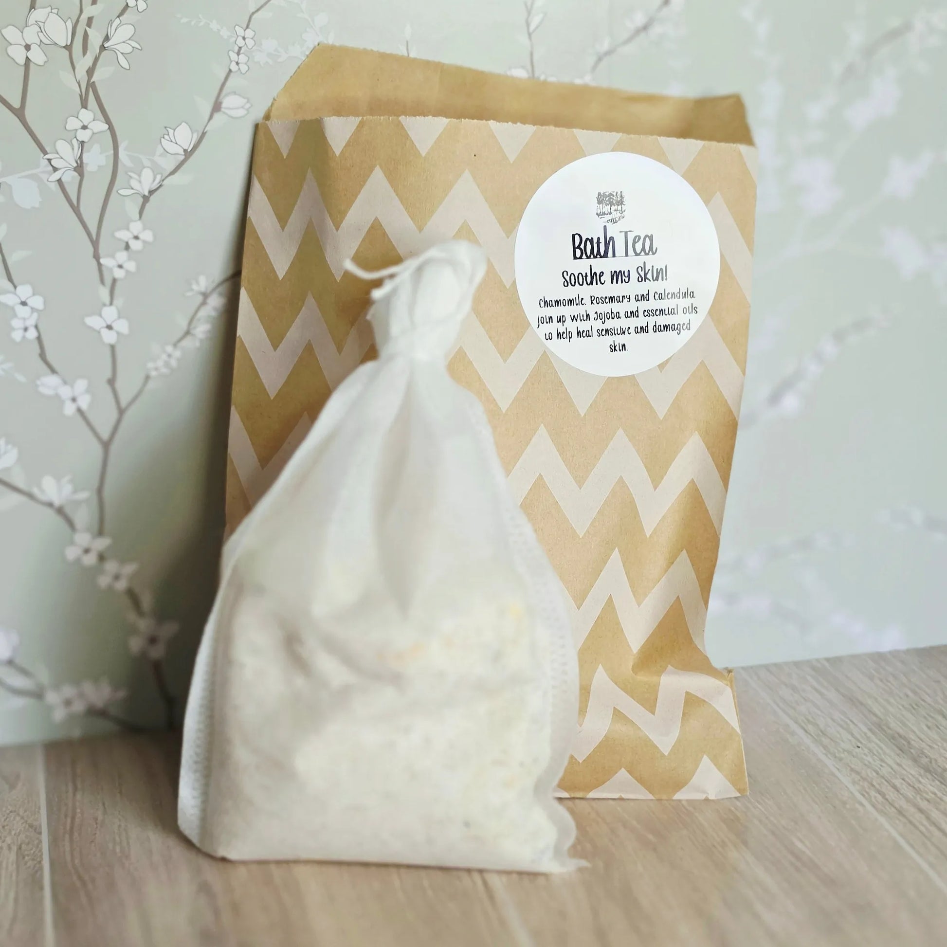 Cedar Creek Farms Soothe My Skin Bath Tea product front package with sachet view showing labeled bag and mesh bath tea pouch on wooden surface